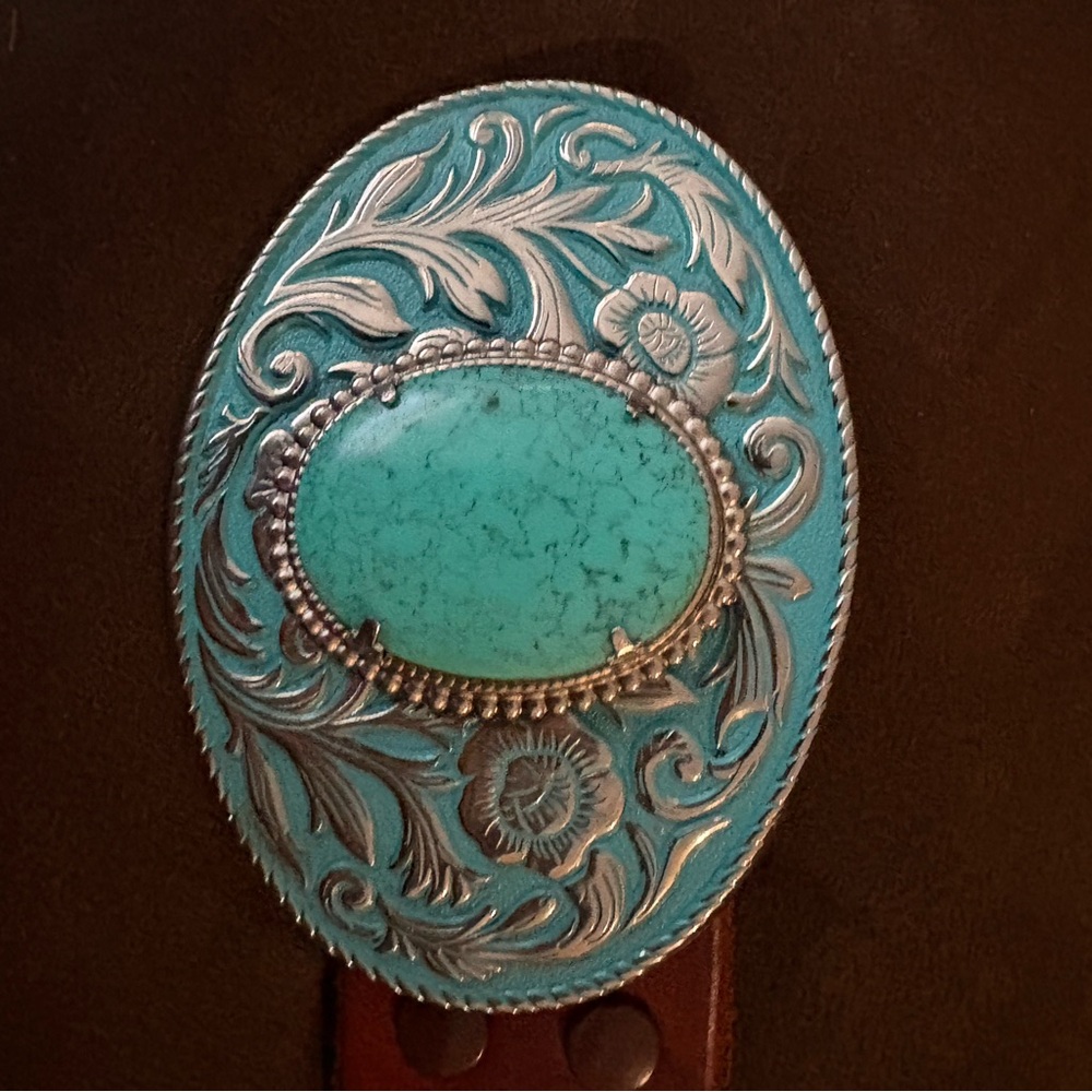 Embossed, faux turquoise and silver women’s belt.